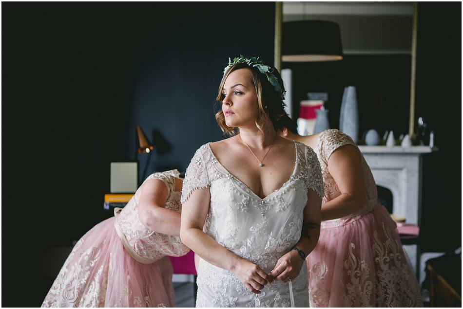 Bride wearing a flower crown getting ready for her Hampton Manor secret garden wedding