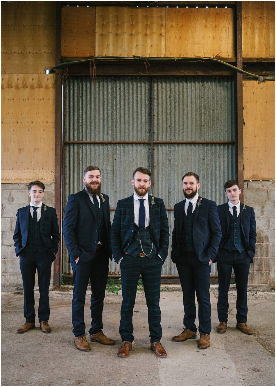 Portrait of a Groom with his Groomsmen on his wedding day at Curradine Barns