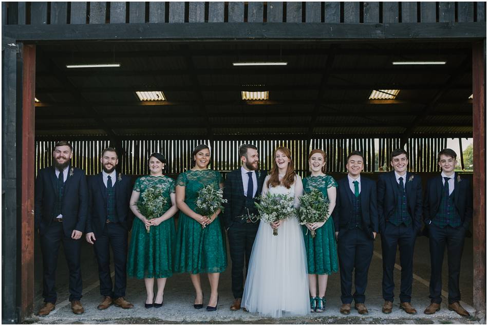 Relaxed bridal party group photo at Curradine Barns