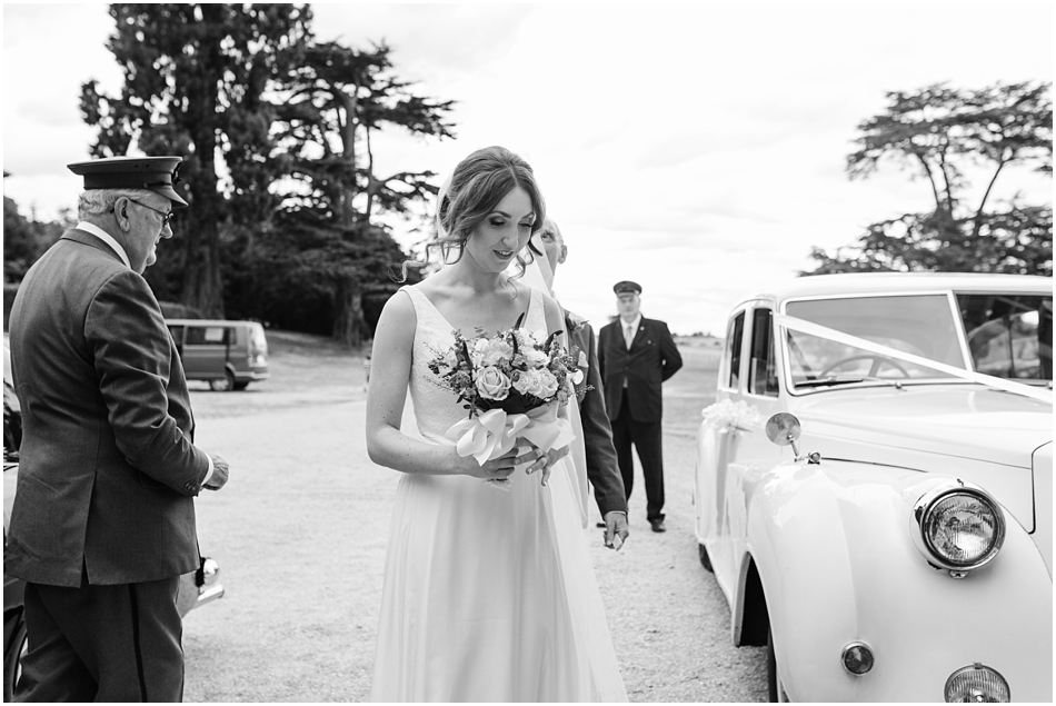 Bride arriving in the wedding car in front of Compton Verney in Warwickshire