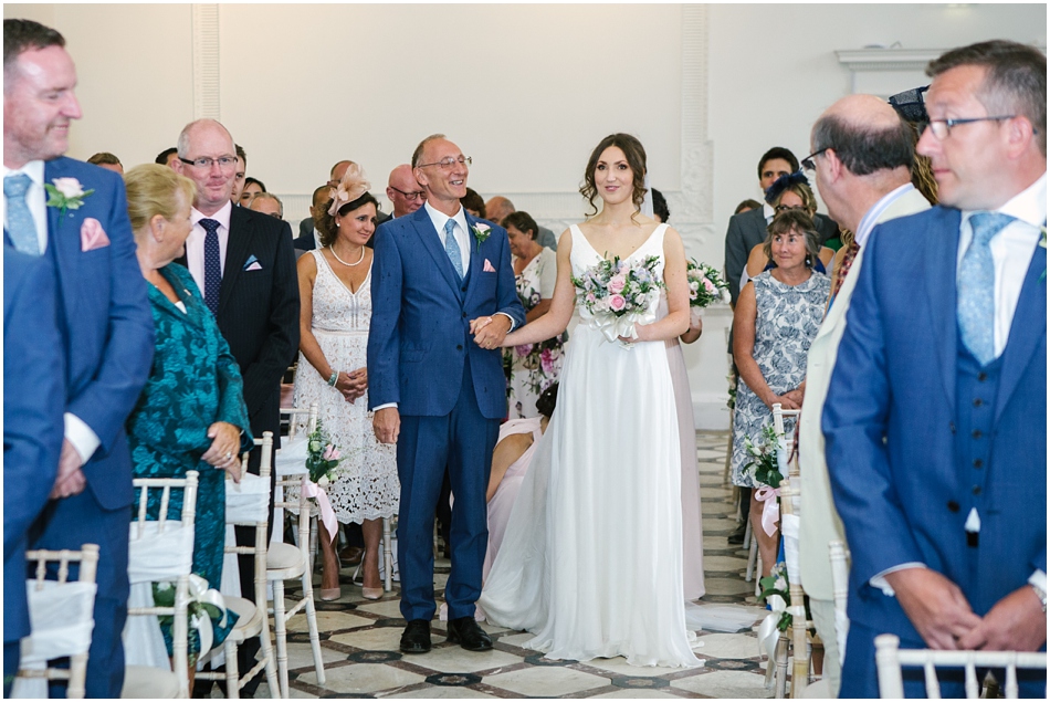 Bride and her Dad walking down the aisle at Compton Verney