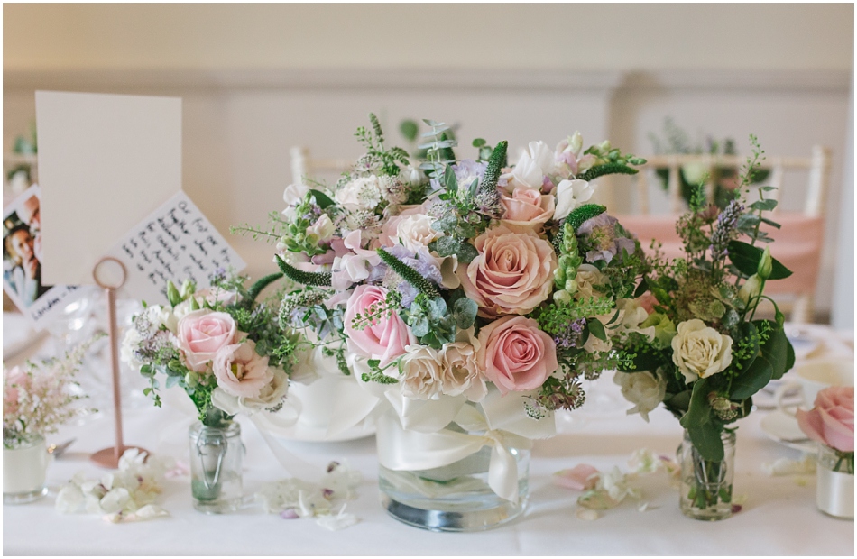 pastel table centres, with pink roses and green foliage at a Compton Verney wedding