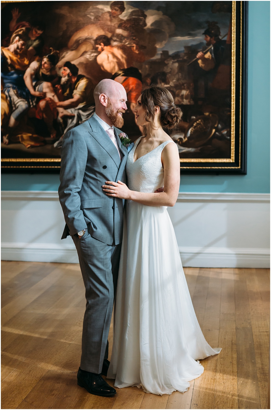 Compton Verney Wedding Photography; Bride and Groom portrait indoors in front of paintings