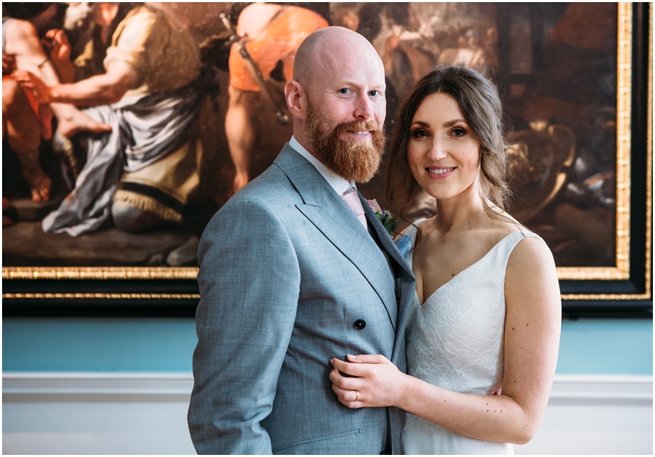 Compton Verney wedding photography; Bride and Groom portrait in front of art on their wedding day