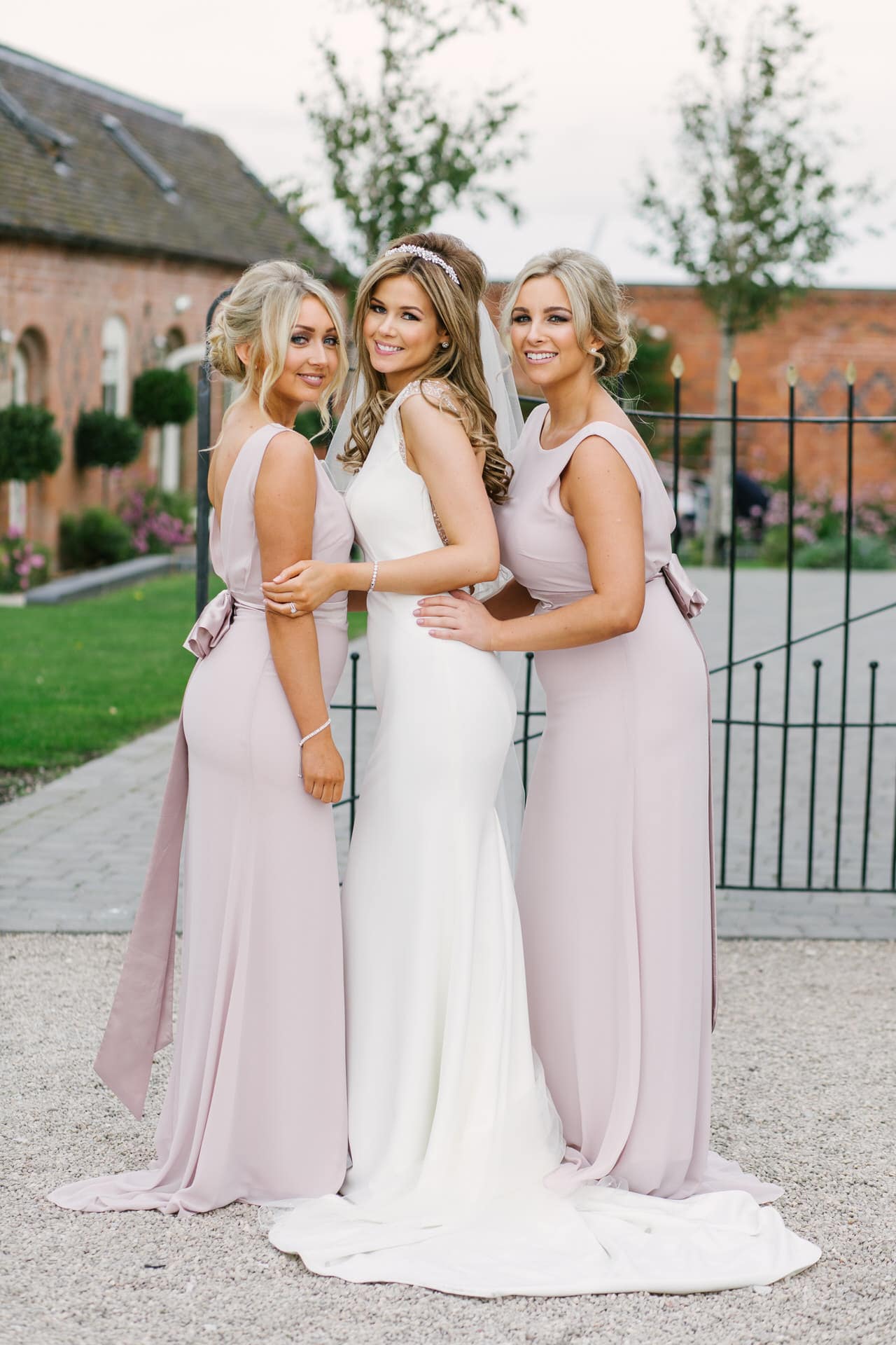 Bride & Bridesmaids in pastel dresses at Alrewas Hayes