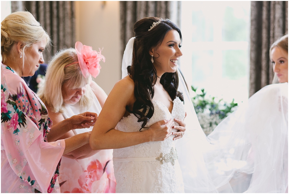 Bride getting ready in the Bridal suite, on the day of her romantic Iscoyd Park wedding