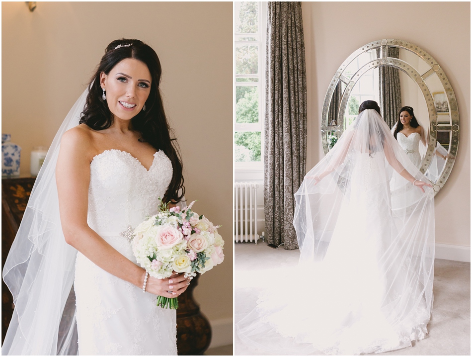 portrait of a Bride with long veil and bouquet of roses, at a romantic Iscoyd Park wedding