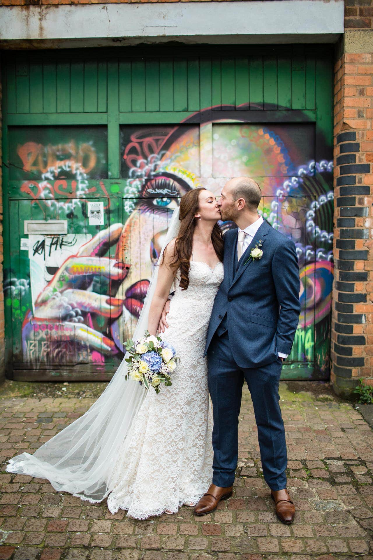 Bride & Groom kissing in front of Graffiti in Digbeth, Birmingham