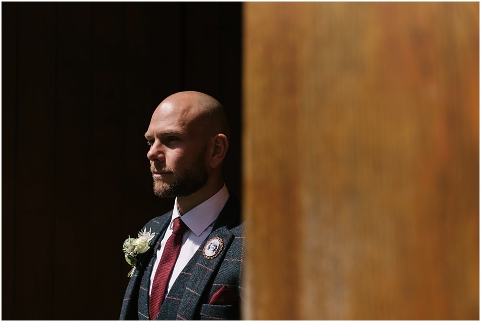 Portrait of a Groom on the wedding day, in the doorway at Hope Street Hotel