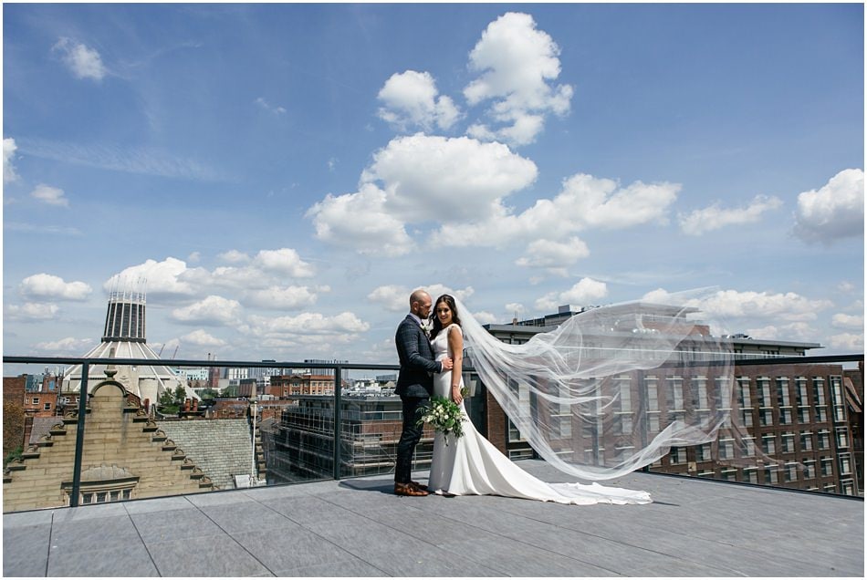 Modern Hope Street Hotel wedding photography; Rooftop portrait of Bride and Groom with veil blowing in the wind