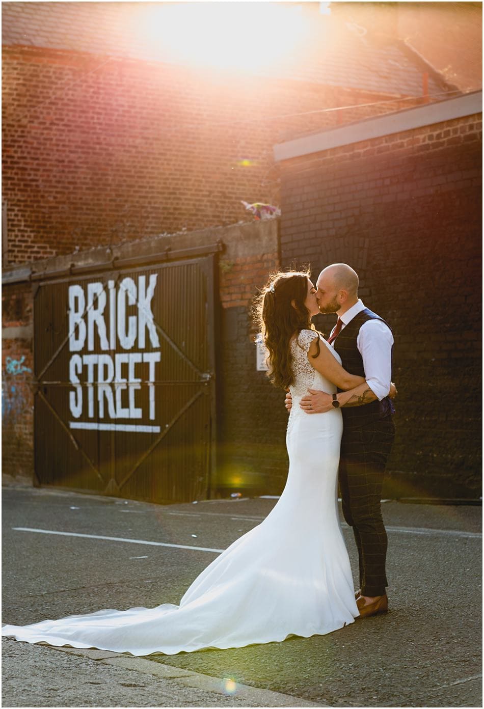 Siren wedding photography; Bride and Groom kiss in the Baltic area in Liverpool