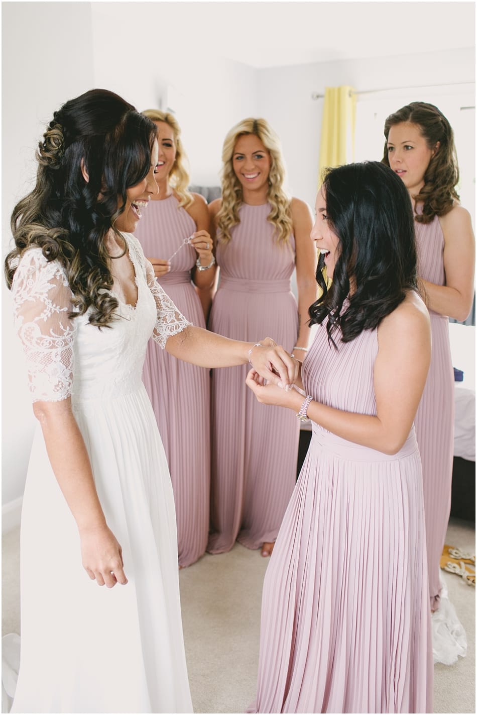 Bride and Bridesmaids in blush pink, getting ready for Gorcott Hall wedding