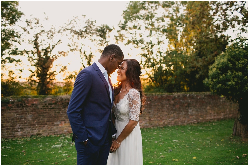 Couple at sunset in the gardens at Gorcott Hall