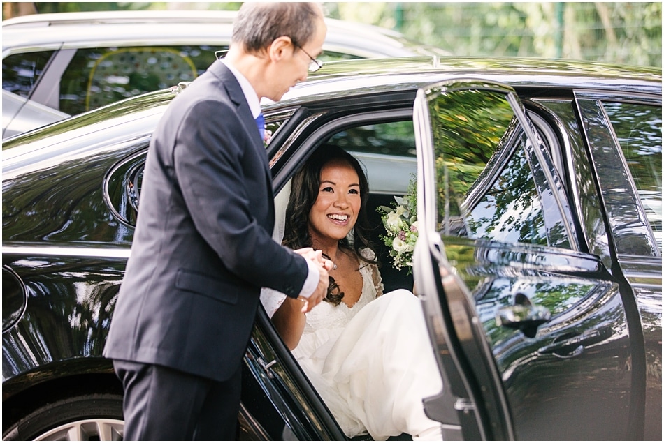 Bride arriving for wedding ceremony at Gorcott Hall