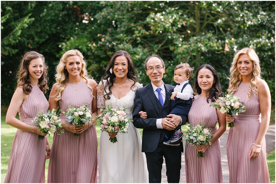 Bride with Bridesmaids and Father at wedding at St Mary's Church, Sheldon