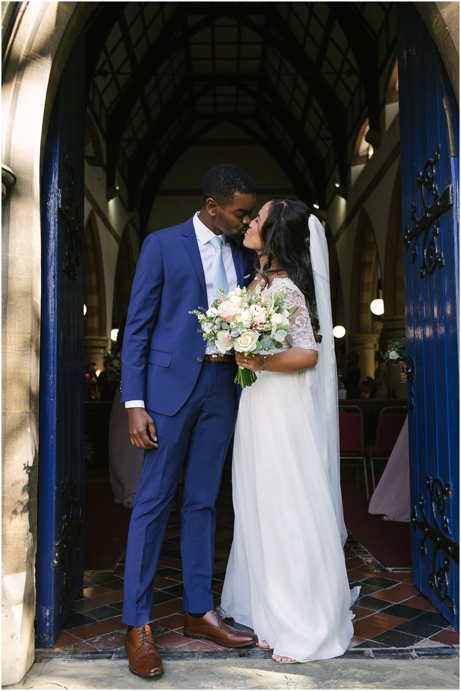 Couple outside St. Mary's Church, Sheldon on their wedding day