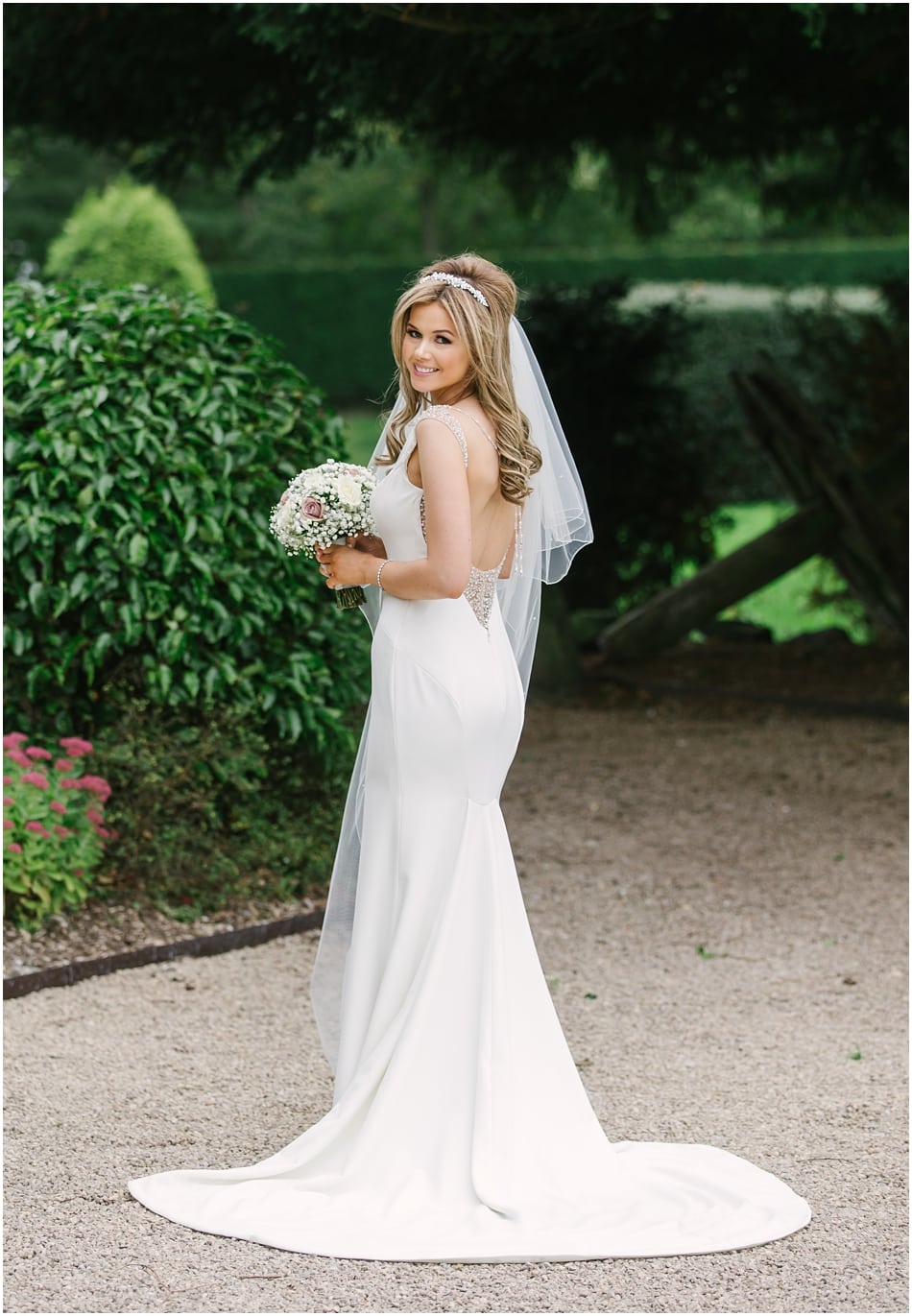 Beautiful bride in low back fitted Pronovias wedding dress