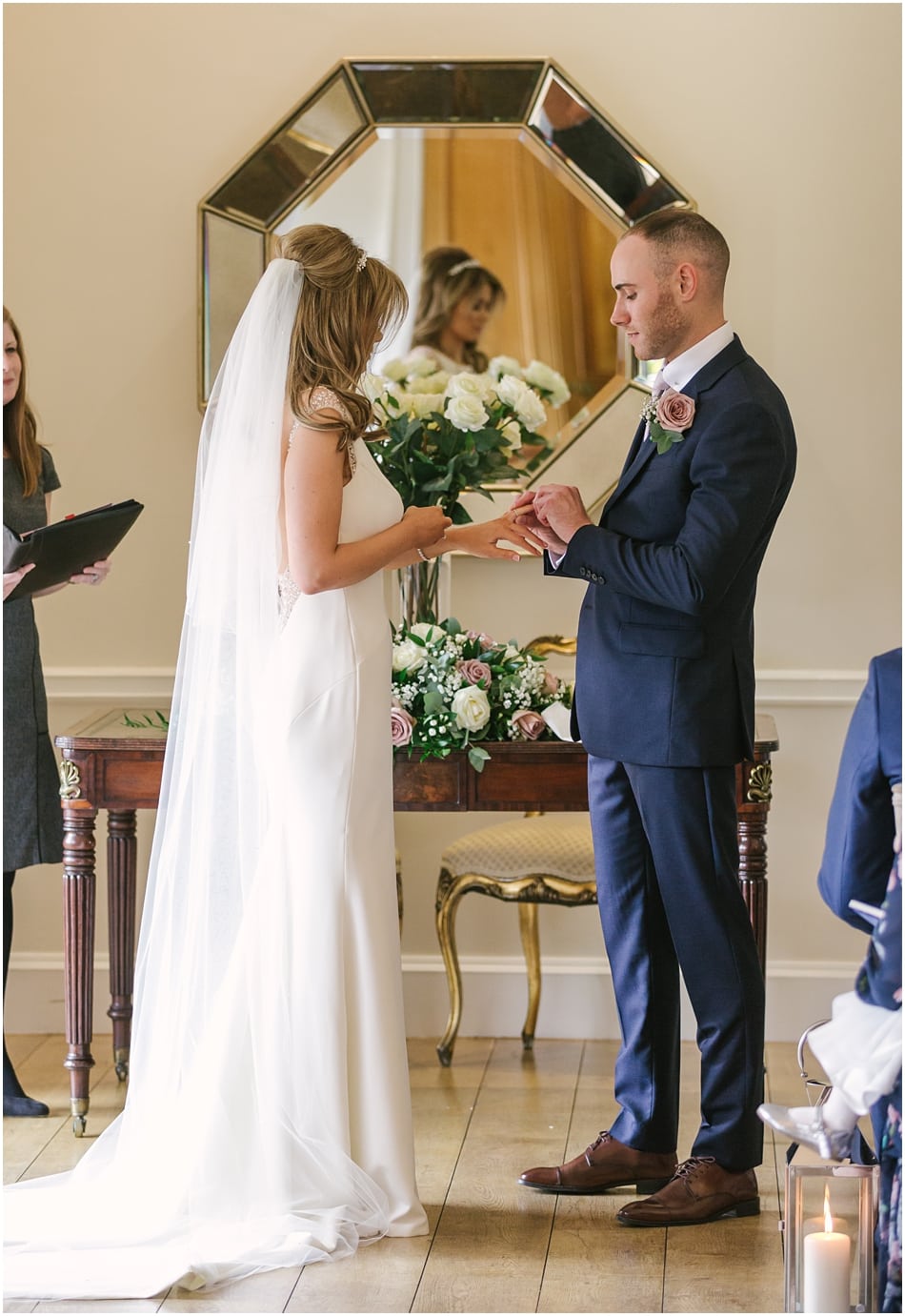 Exchanging wedding rings at an Alrewas Hayes wedding