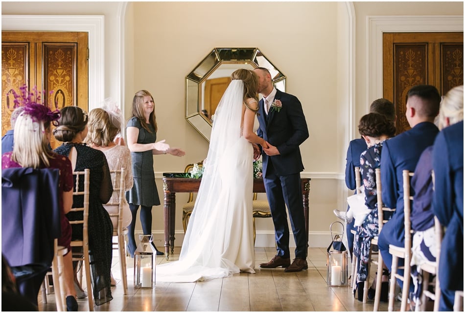 Couple kiss after their wedding ceremony