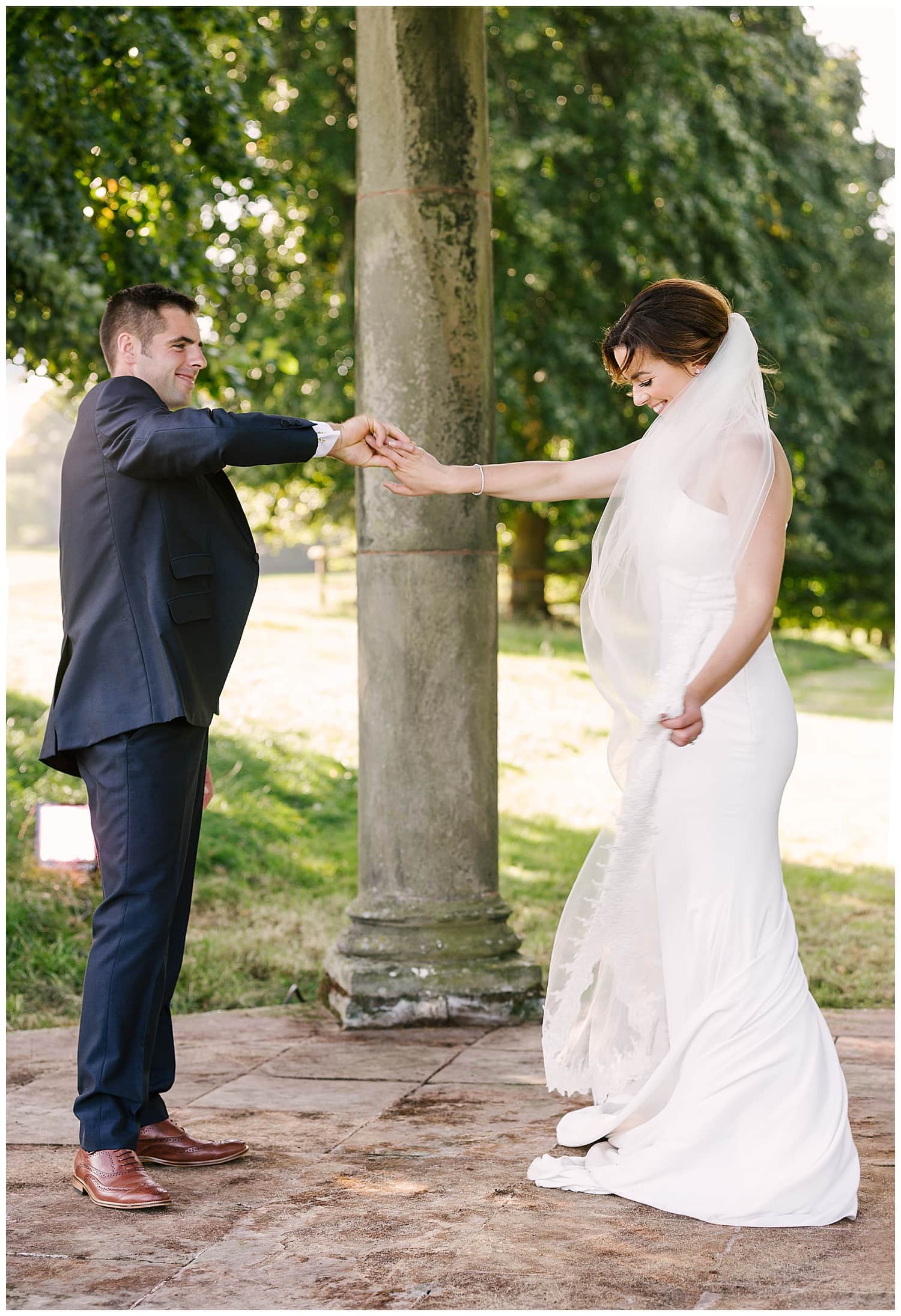 newly married couple practice their first dance at their farm wedding