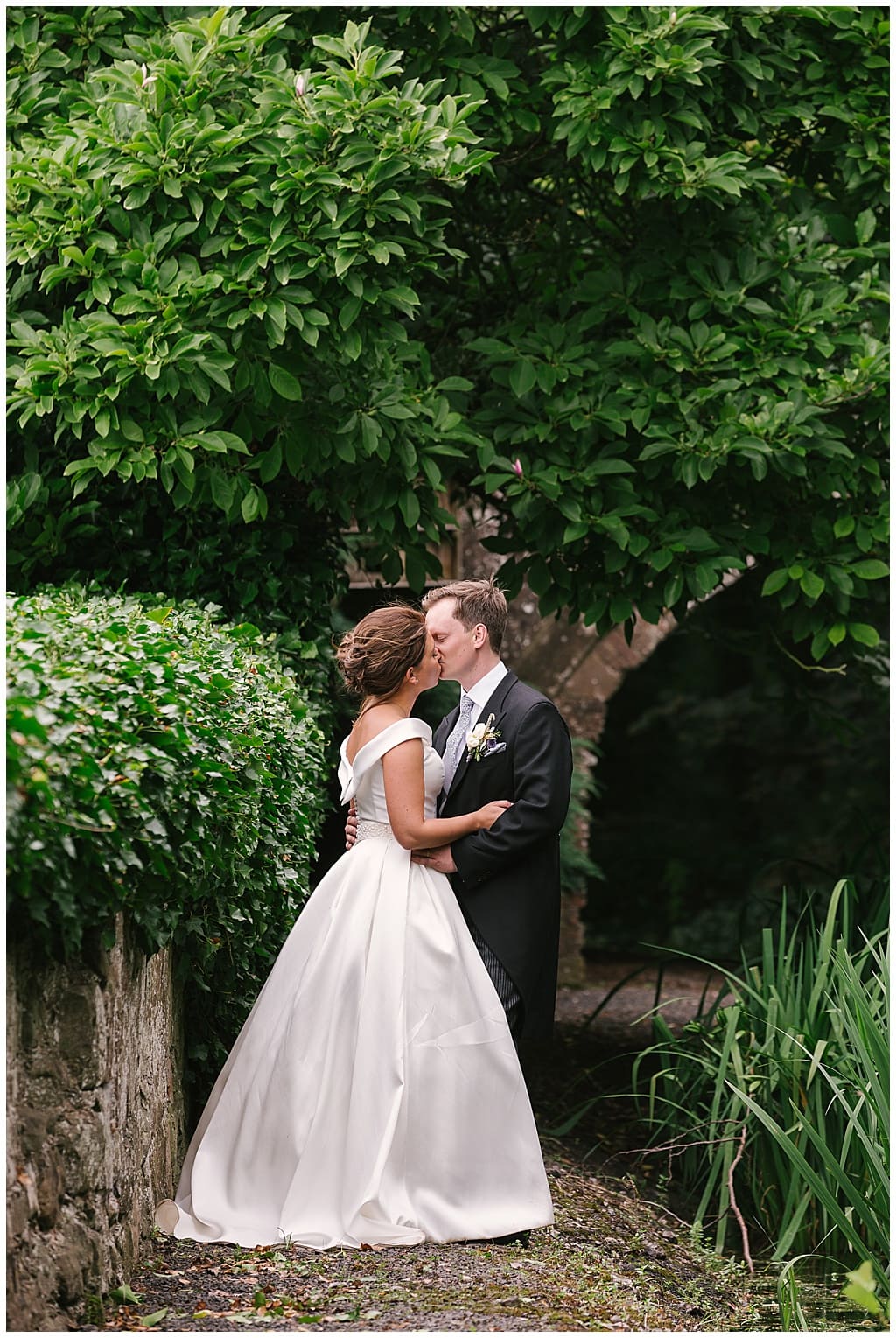 Couple portrait | marquee reception at home with Eddison light bulbs