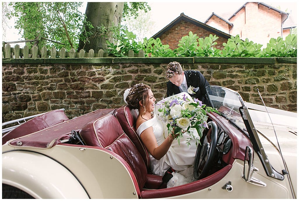 Bride getting into a vintage Morgan | Shropshire wedding photography