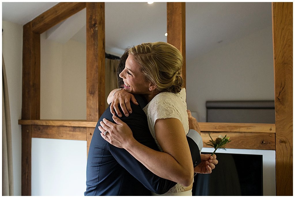 Candid photo of Bride hugging her Dad at Eckington Manor