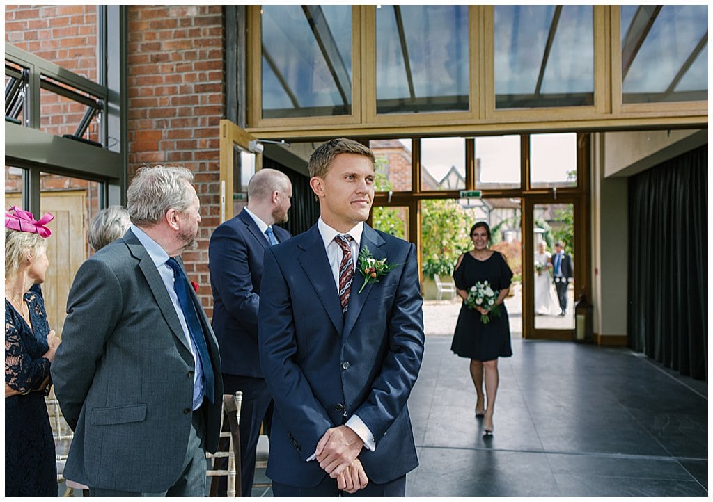 Groom waiting for the Bride to arrive at his Barn wedding in Worcestershire