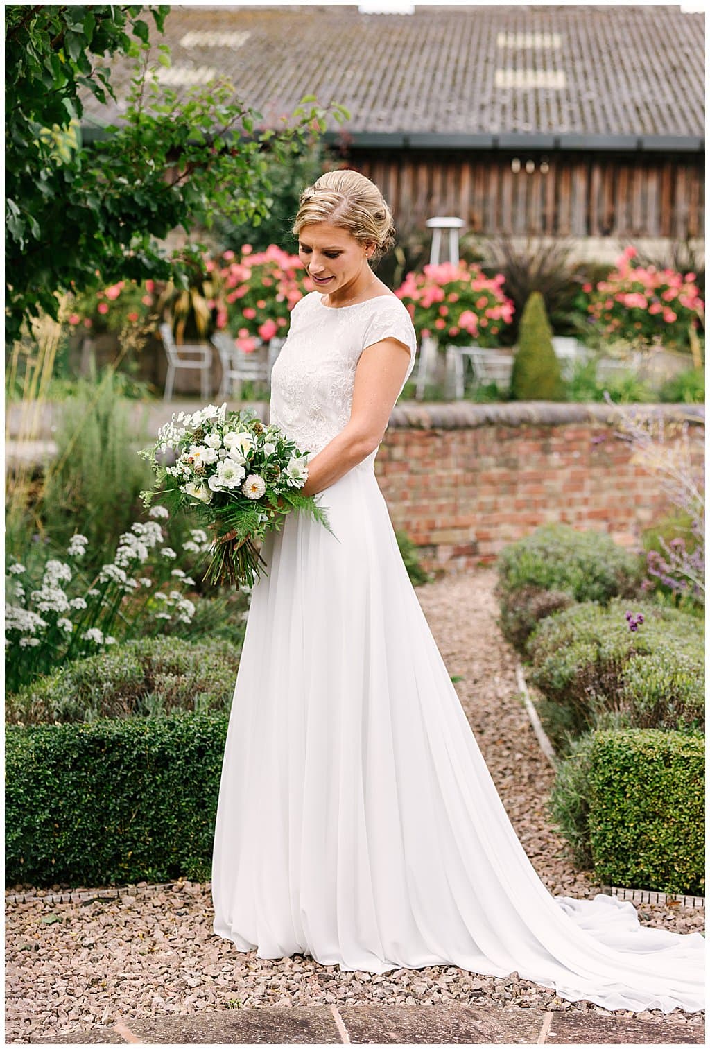 Portrait of Bride wearing Dana Bolton wedding dress in the gardens of Eckington Manor