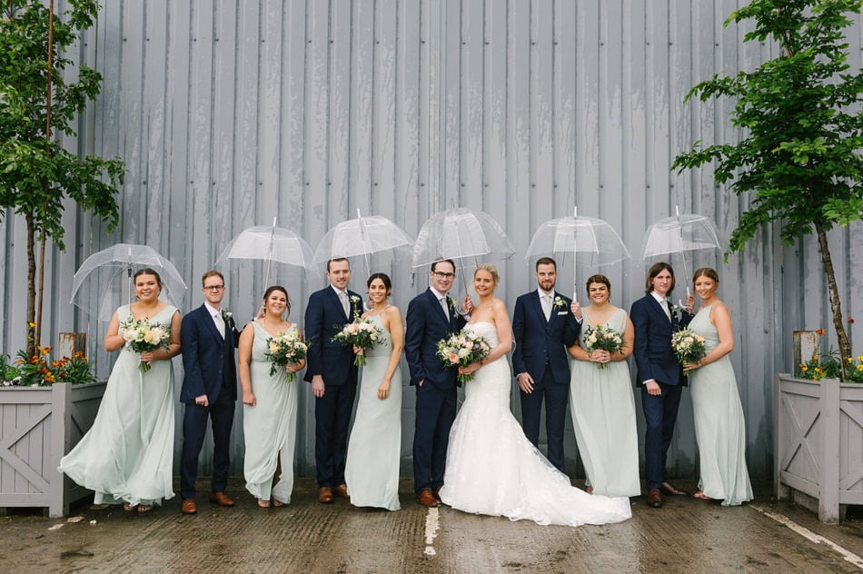 Bridal party photo with umbrellas at Alrewas Hayes