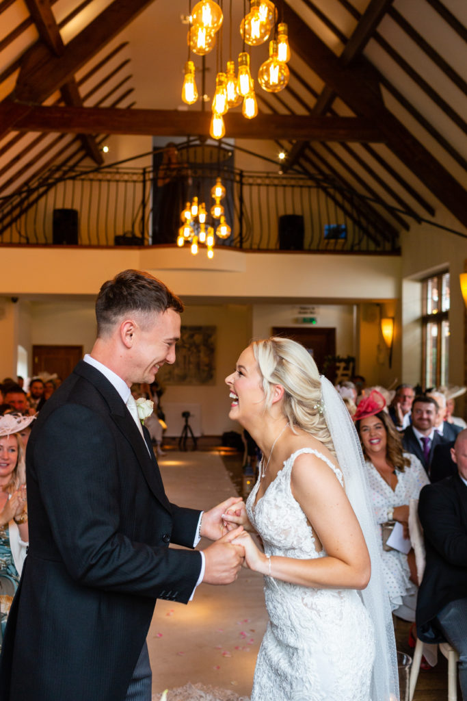 Nuthurst Grange wedding photography; Bride and Groom during their classic civil ceremony