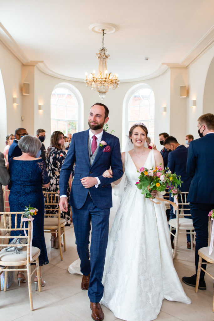 Iscoyd Park wedding photography; Couple walking down the aisle after their civil ceremony