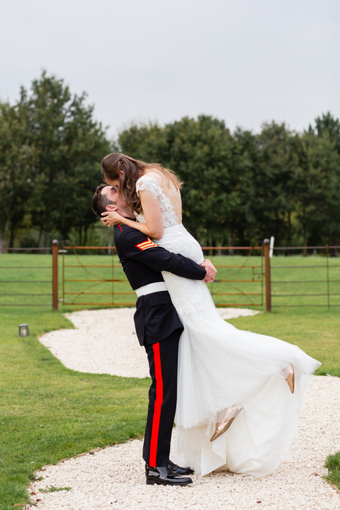 Military wedding photography Midlands; Army Groom picks up his bride