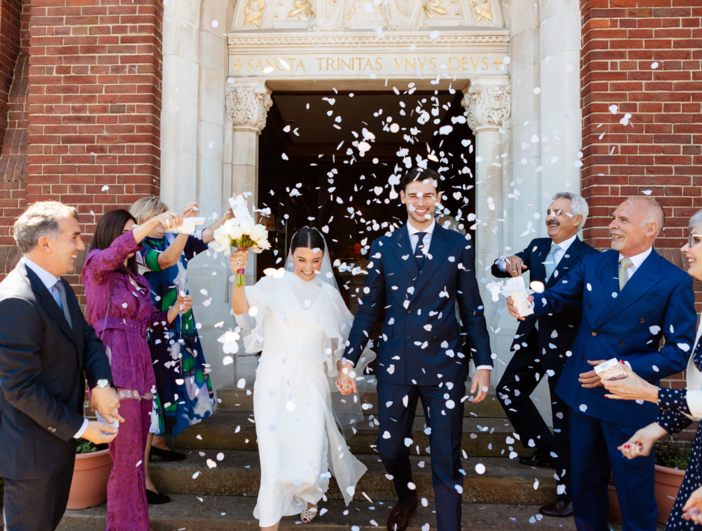 confetti photo of Bride and Groom leaving Holy Trinity Church