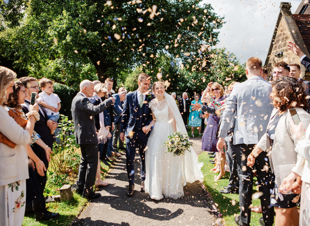 Staffordshire wedding photographer; confetti outside church near Elford