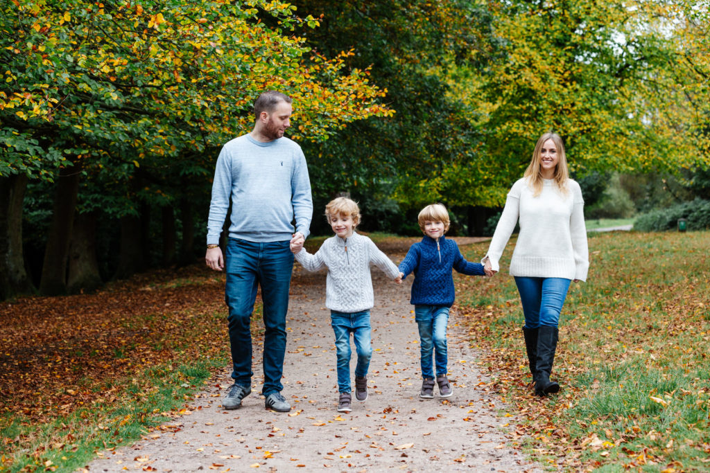 family photography walking in the park holding hands