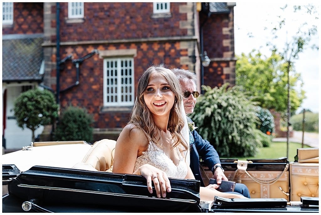 Bride arriving in horse drawn carriage to her Smallwood church wedding