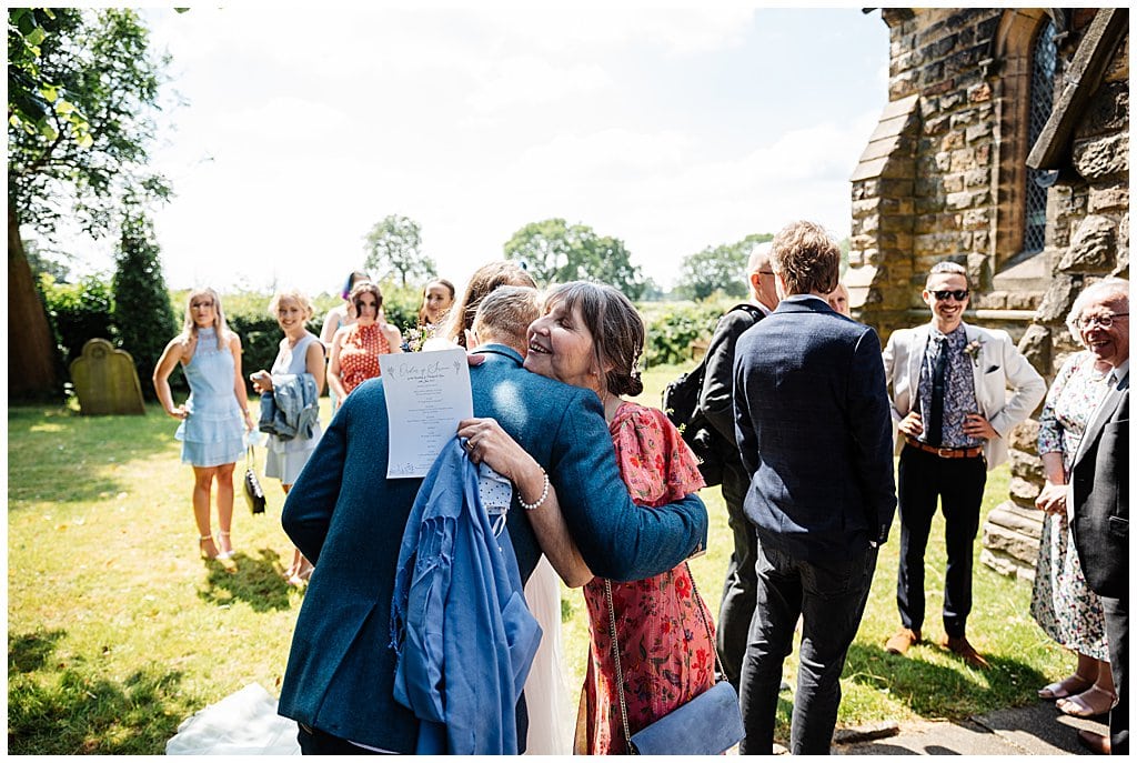 guests congratulating newlyweds outside Smallwood church 