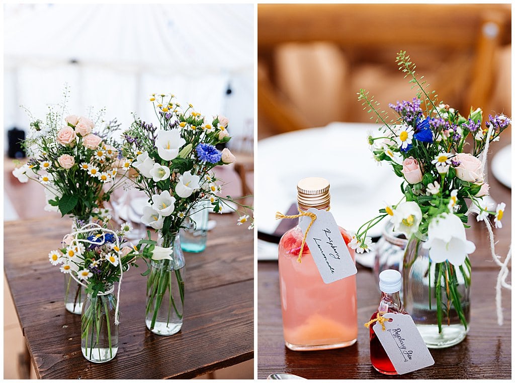 home made gin favours and wild flowers in bottles
