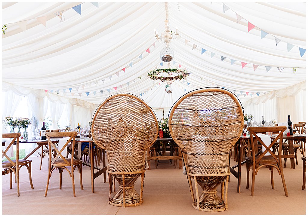 wicker cane balloon back chairs at a boho wedding