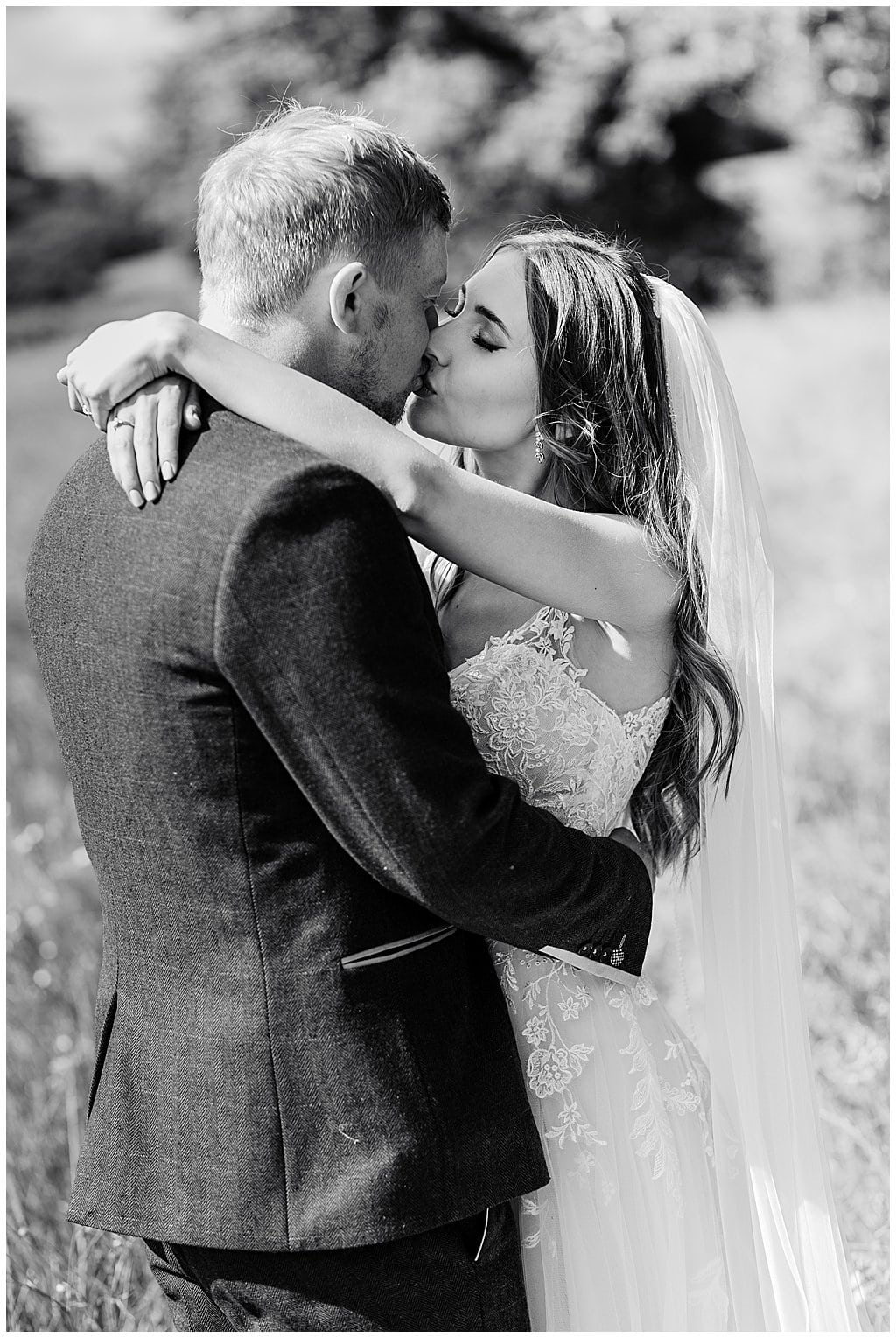 romantic photo of Bride and Groom kissing after their church wedding in Smallwood