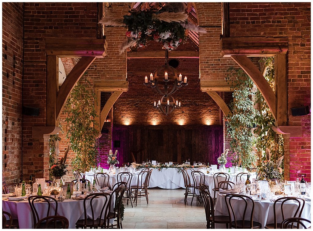 the ceremony room with round tables at Shustoke Barn wedding venue