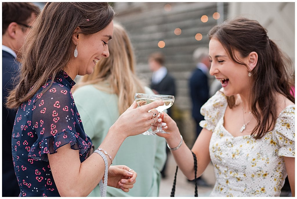 informal photo of wedding guests enjoying a cocktail outside Pimhill Barn