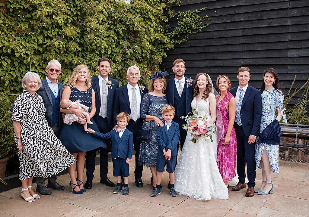 wedding group photo outside Curradine Barns