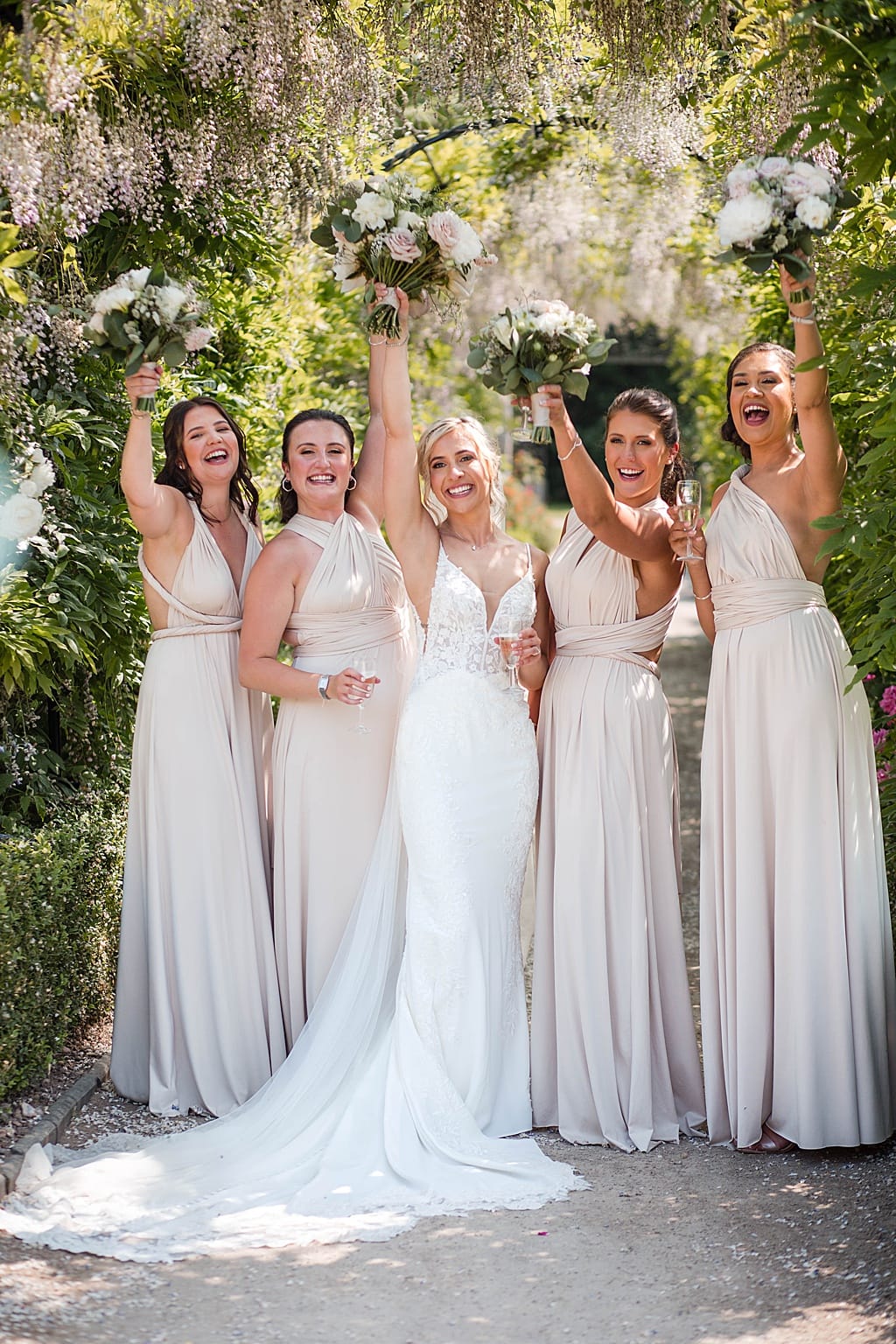 Bride and Bridesmaids at a fun Summer wedding at Thorpe Garden