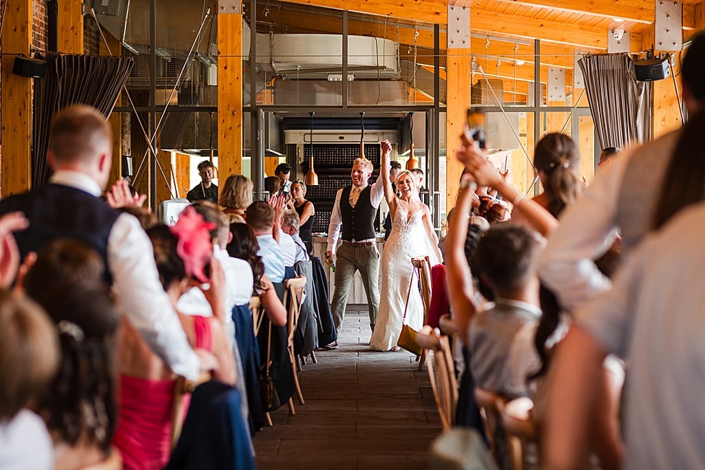 joyful entrance of a Bride and Groom into their wedding breakfast