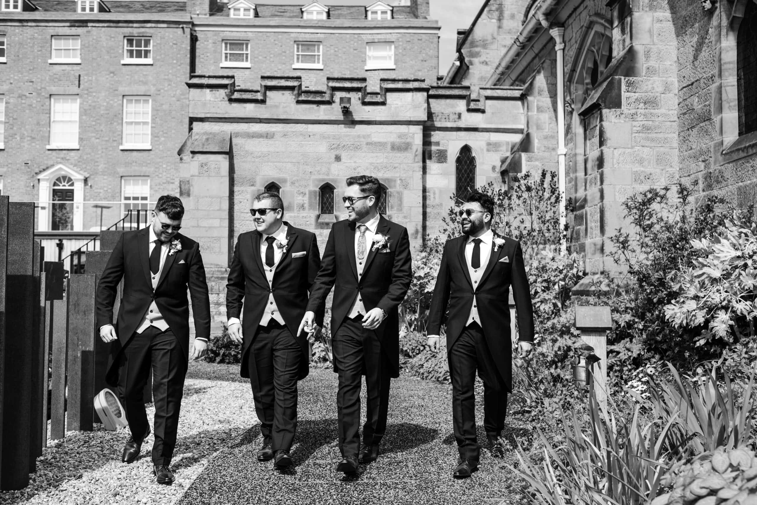 Groom and his Groomsmen walking to church at Shrewsbury Cathedral