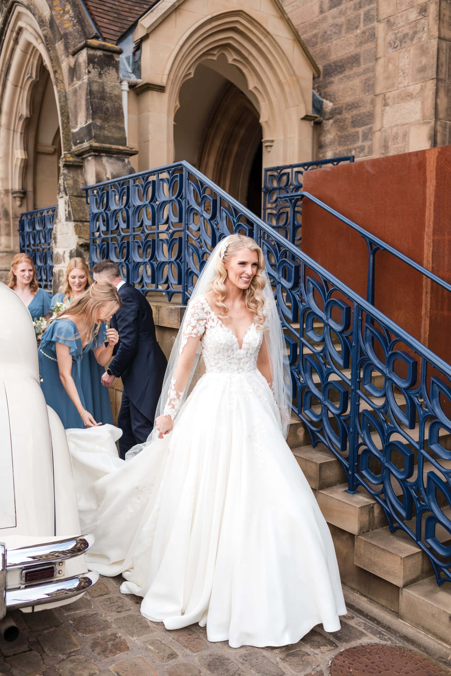 Bride standing outside Shrewsbury Cathedral when she arrives for her wedding ceremony