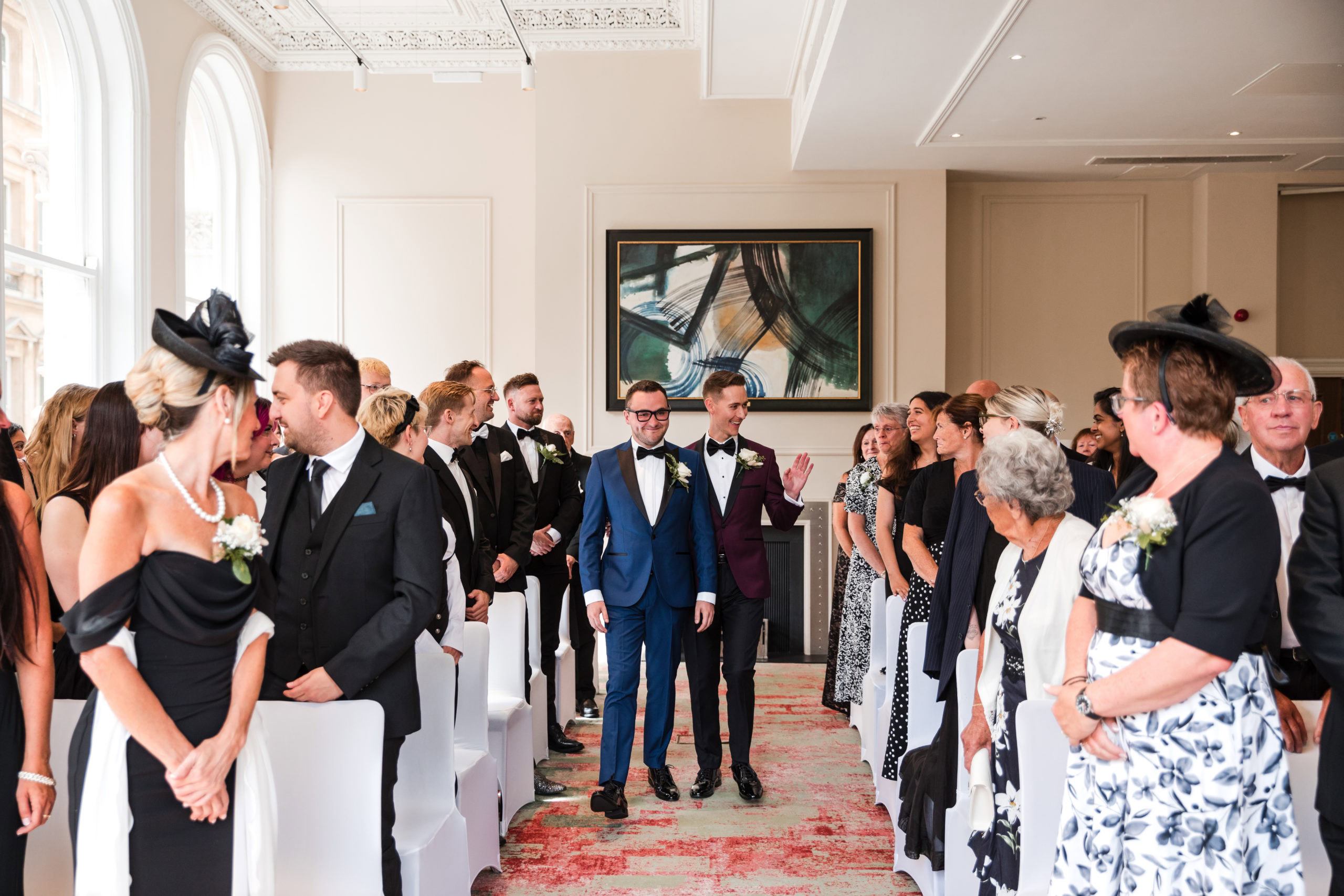 Two Grooms walking down the aisle at their wedding at The Grand Hotel in Birmingham