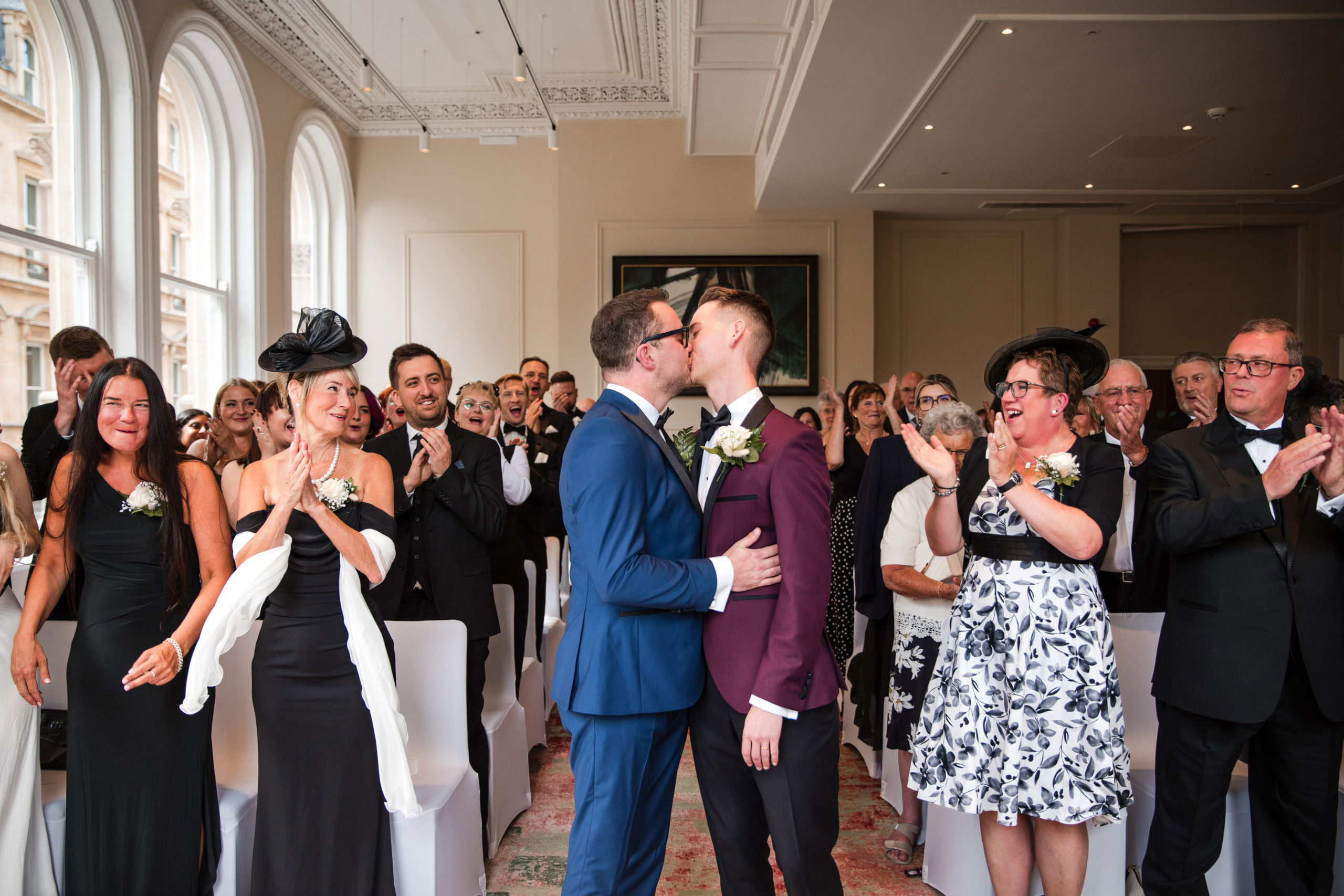 two grooms share a just married kiss at a LBTQ+ friendly wedding venue in Birmingham, The Grand Hotel